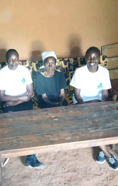 Kemunto at her house with Action Smiles members